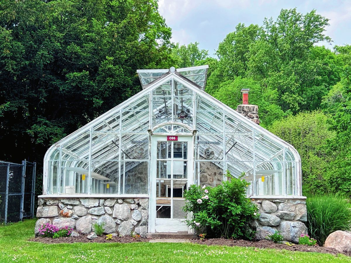 Victorian glass greenhouse on a stone base